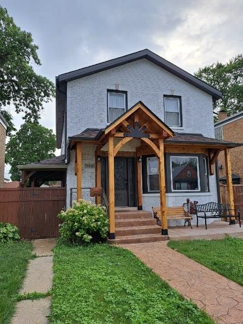A person is painting a wall with a paint roller.