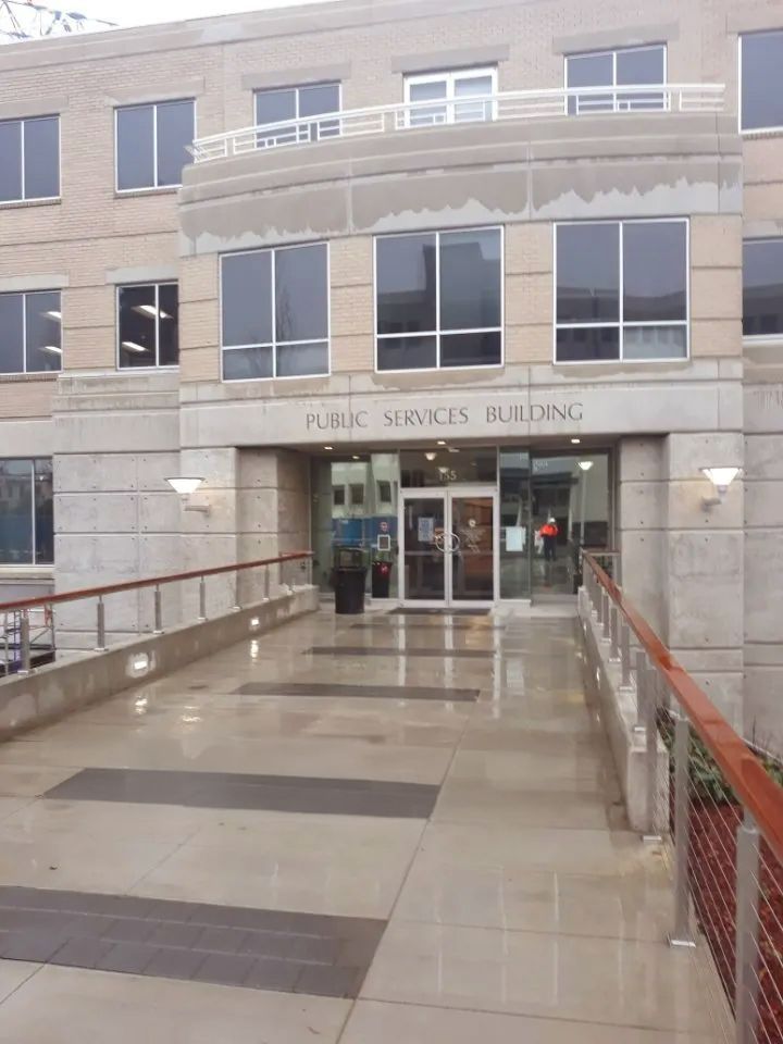 Public Services Building entrance with ramp and text 