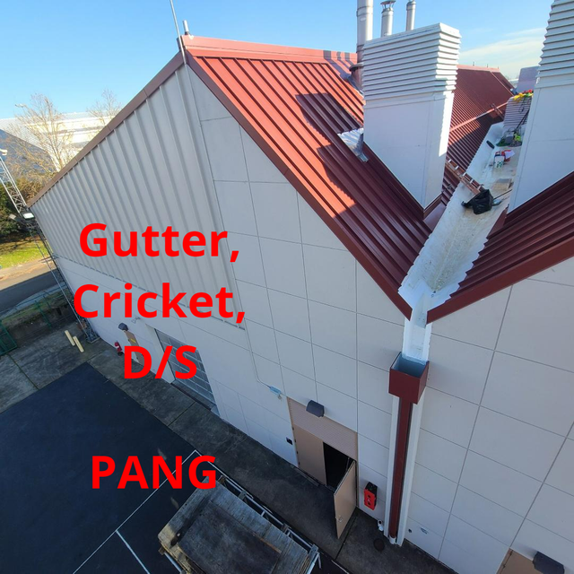 Building exterior with red roof, white walls, and a visible gutter labeled 