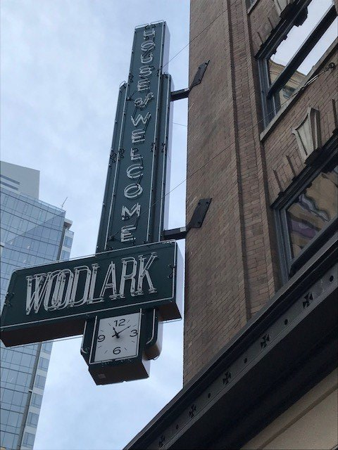 Neon sign for Woodlark hotel. It reads 