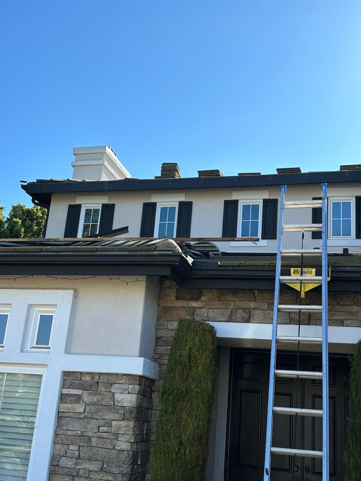 A house with a ladder on the front of it