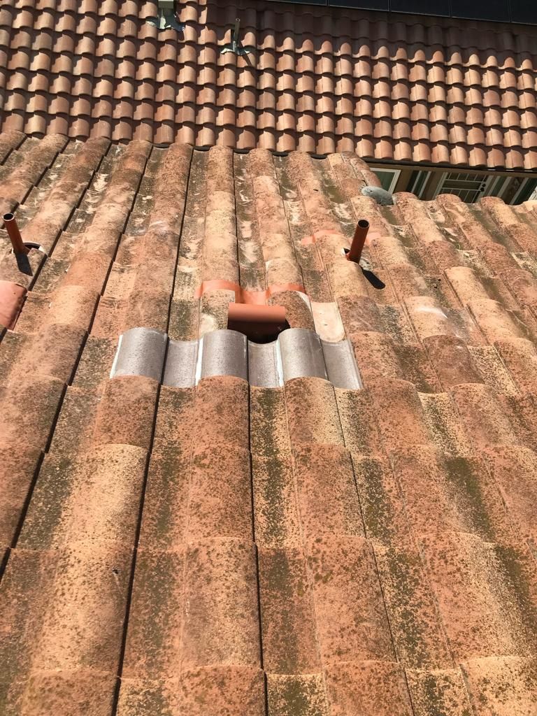 A close up of a roof with a hole in it.