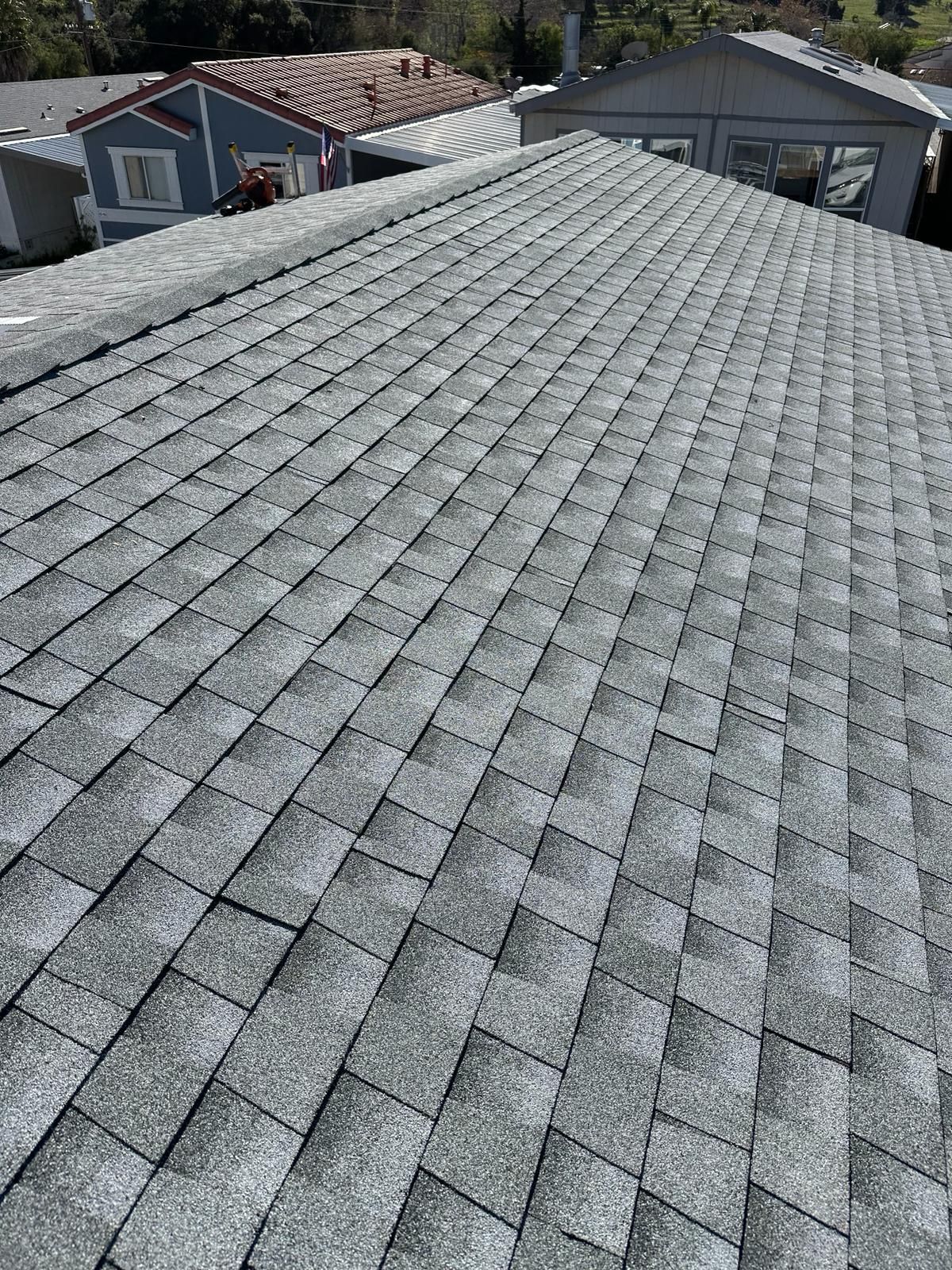 A close up of a roof with a lot of shingles on it.