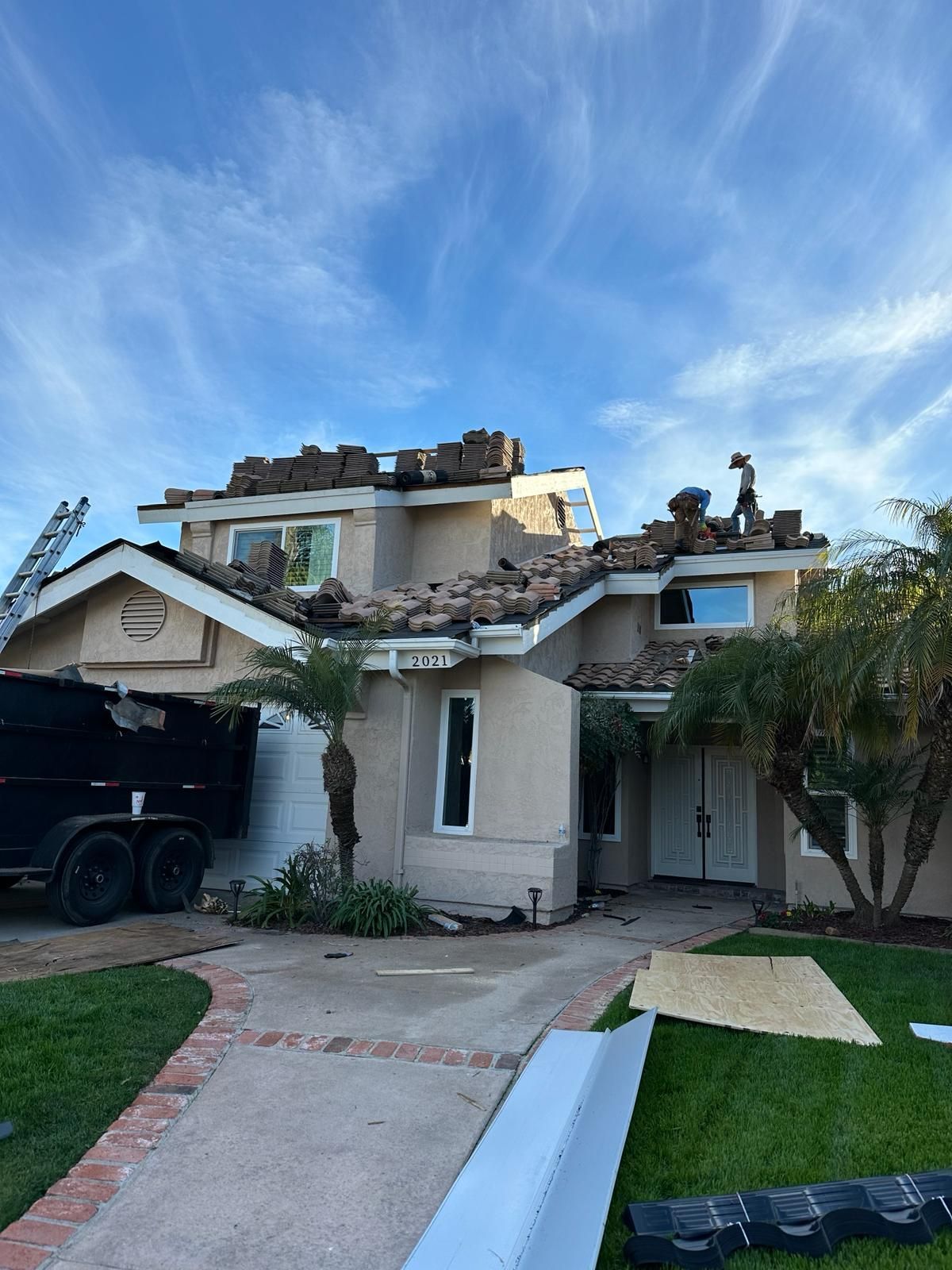 A house with a roof that is being repaired.