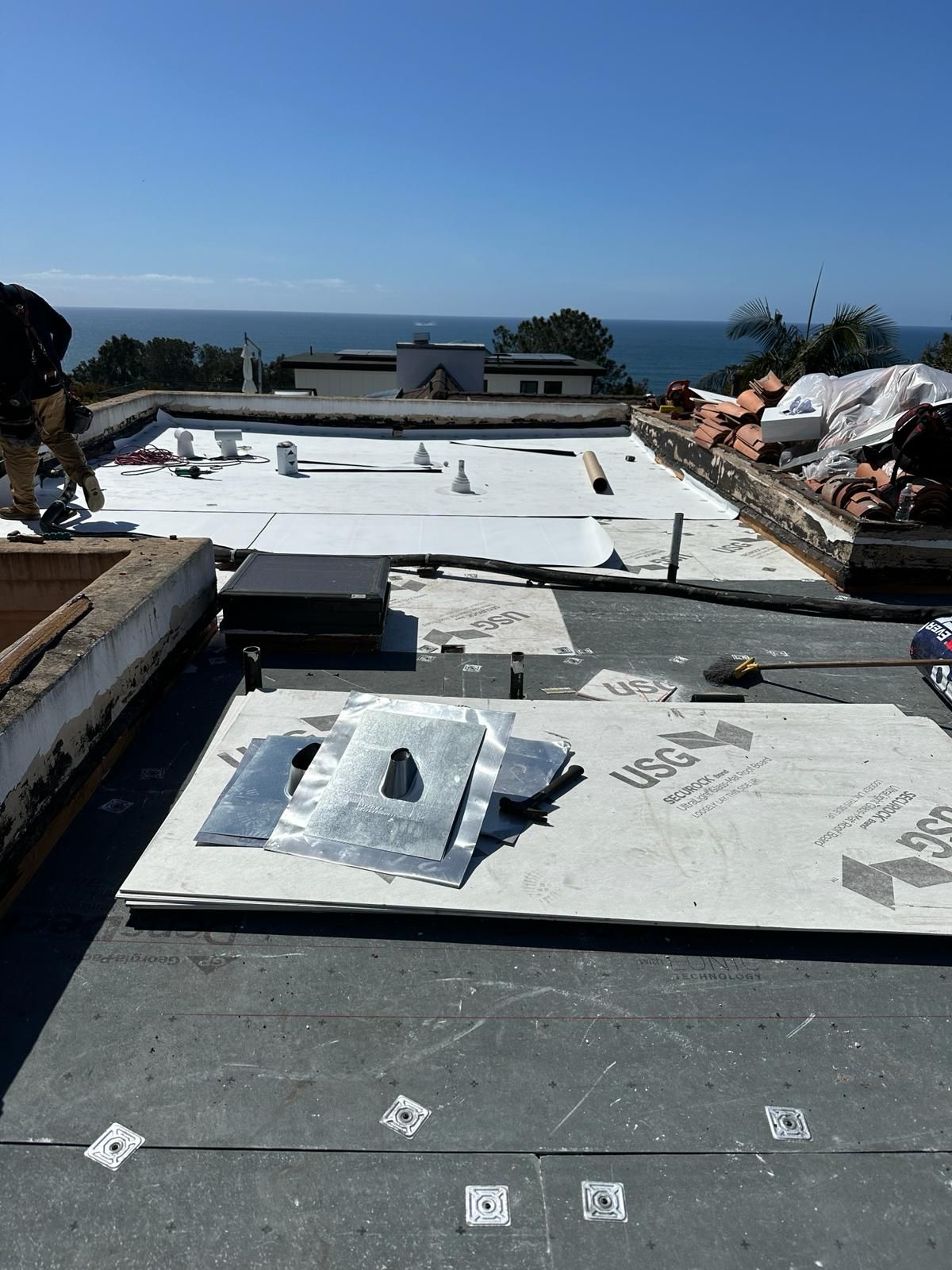 A roof with a lot of pieces of plywood on it