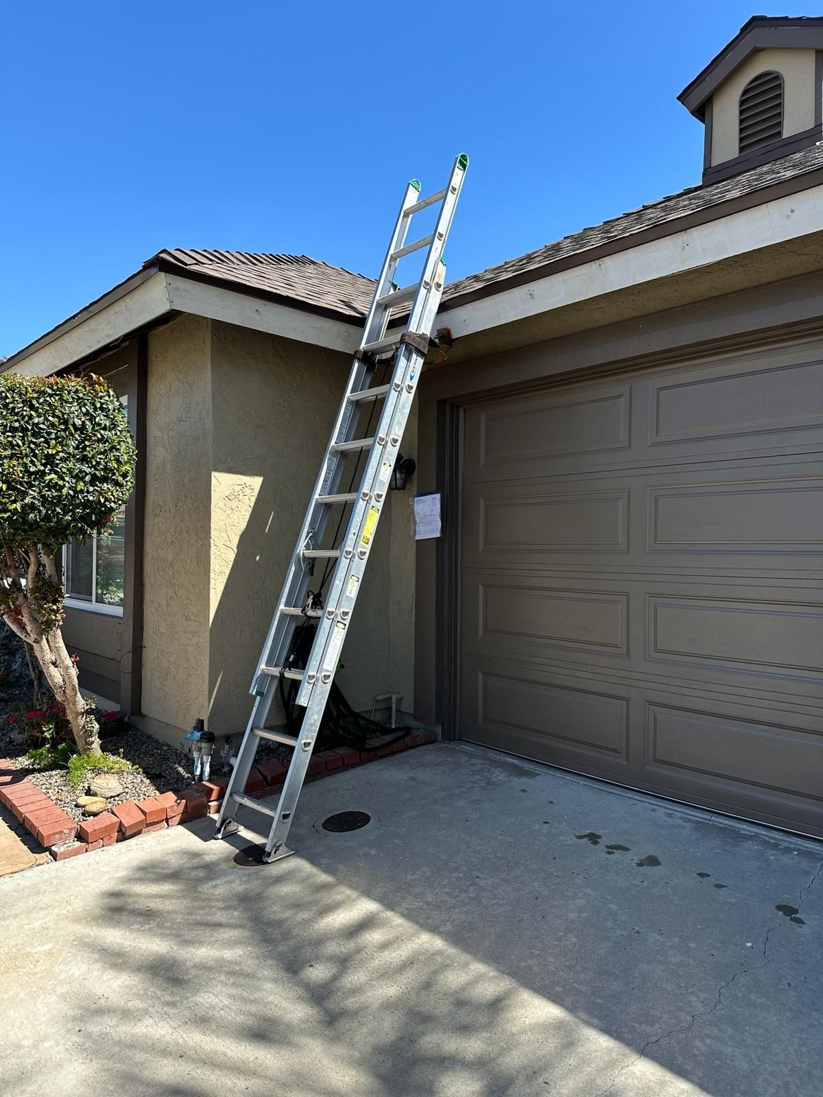 A ladder is leaning against the side of a house.