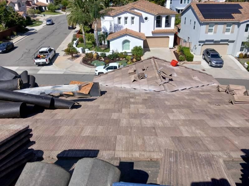 A roof is being repaired in a residential neighborhood