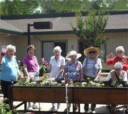 Residents partaking in a gardening activities.