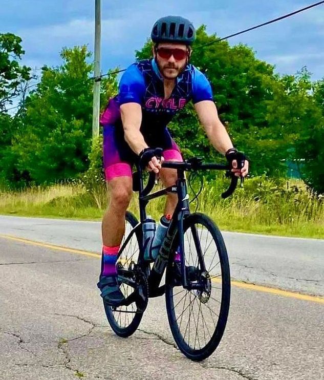 Image of Dr. Peter Lejkowski cycling