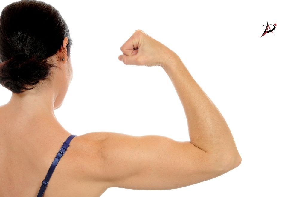 Woman with muscle demonstrating 
