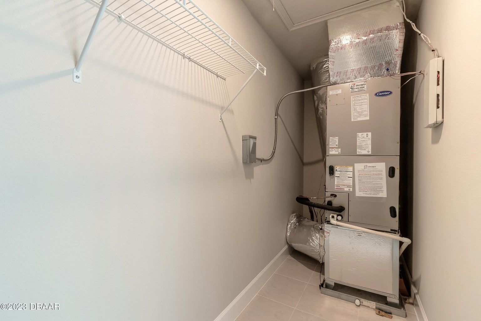 a closet with a stack of air conditioners on top of each other