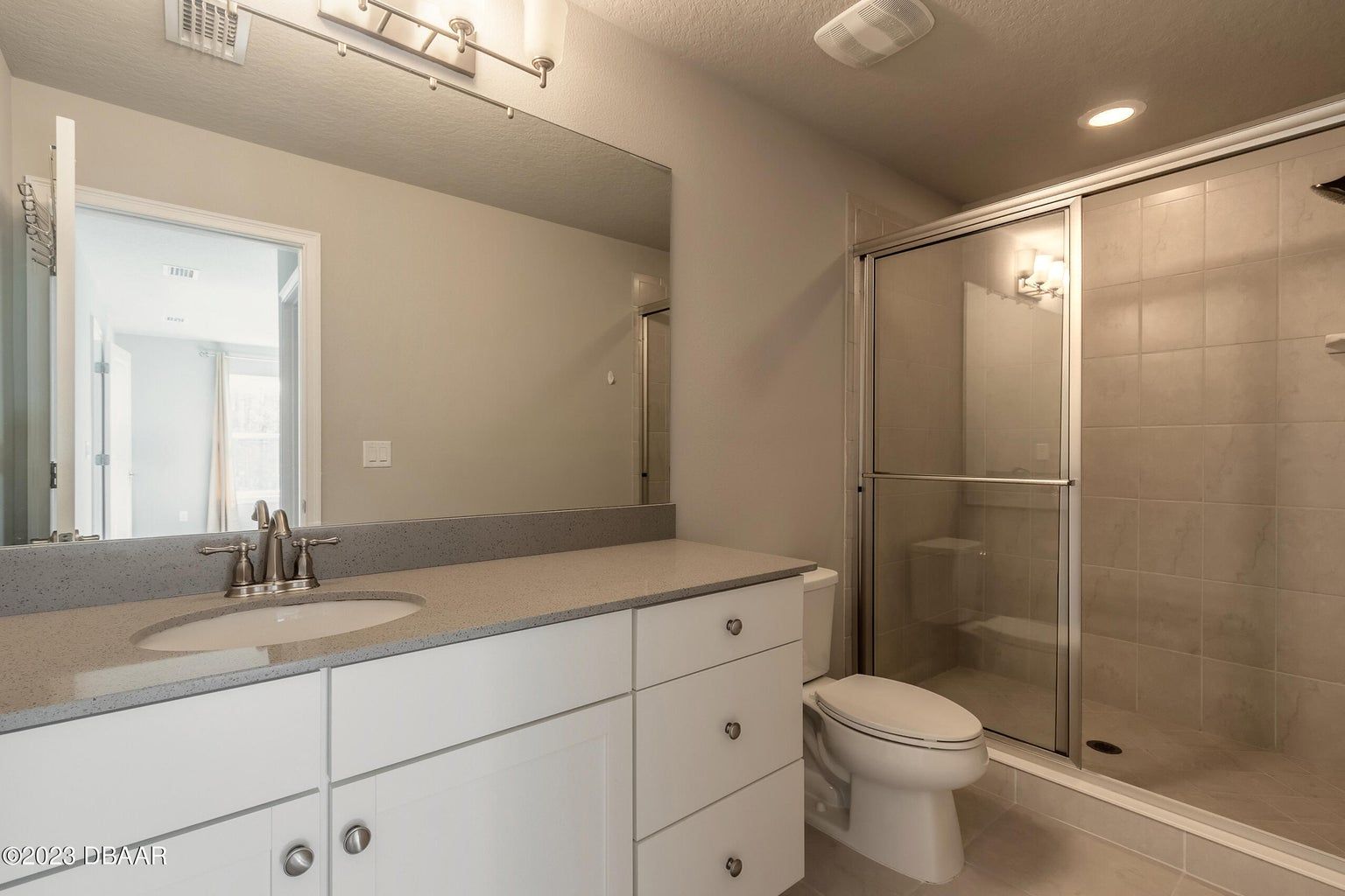 a bathroom with a toilet a sink and a shower