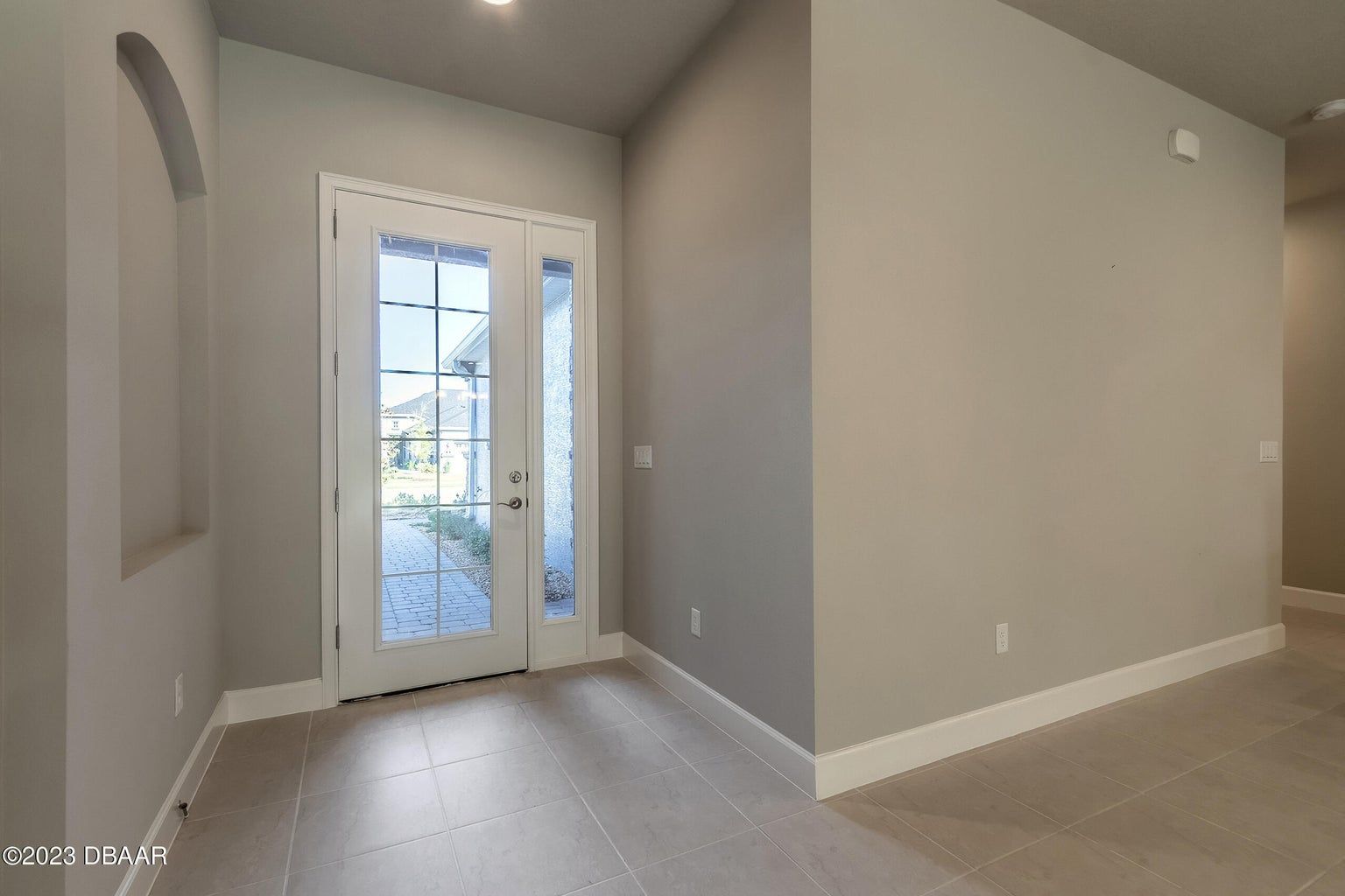 an empty room with a sliding glass door