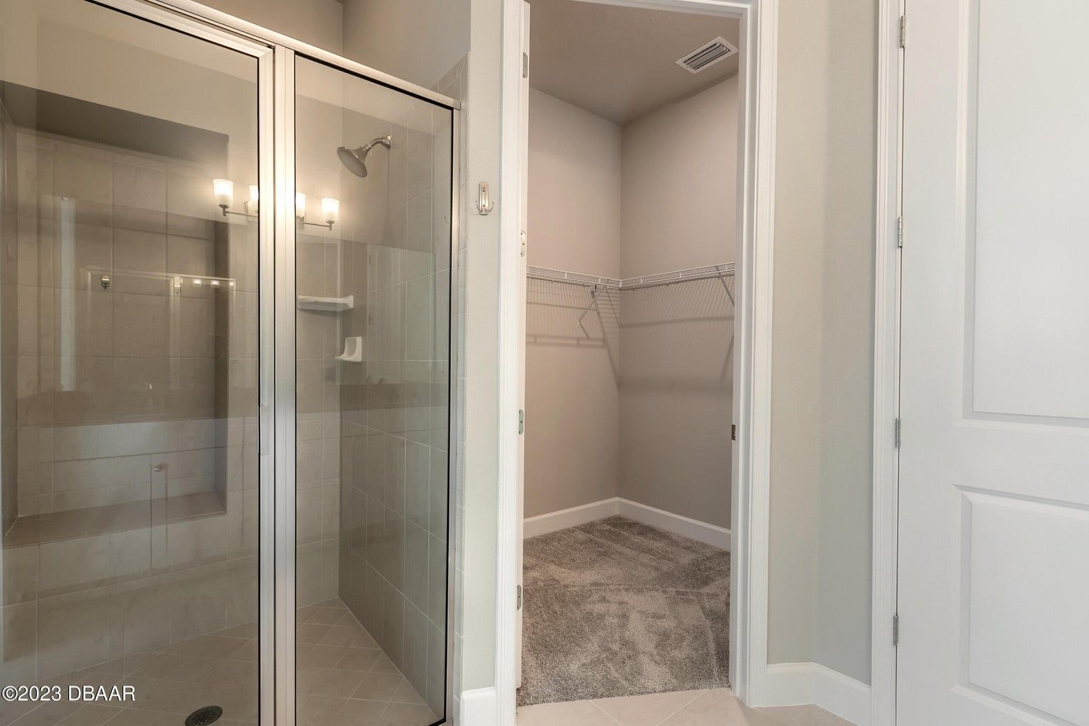 a bathroom with a walk in shower and a bathtub