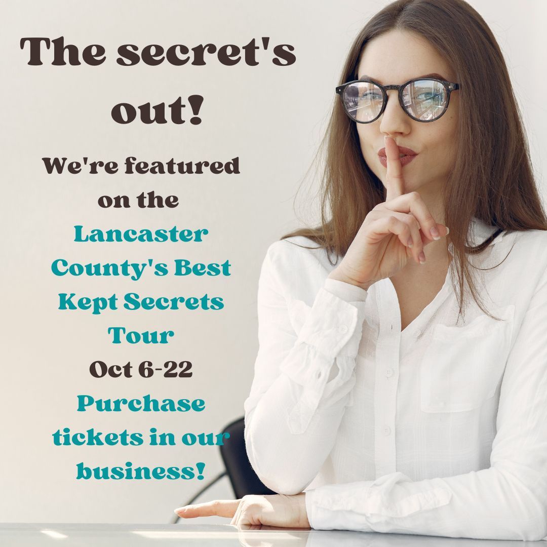 Business woman with finger to mouth signifying she has a secret to keep quiet.