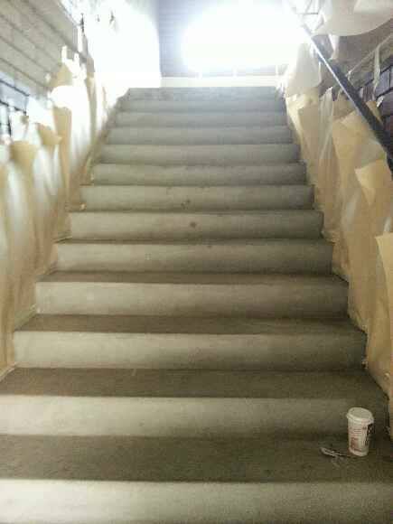A Set Of Stairs With A Cup Of Coffee On The Bottom Of The Stairs — Custom Concrete Finishes In Thurgoona, NSW