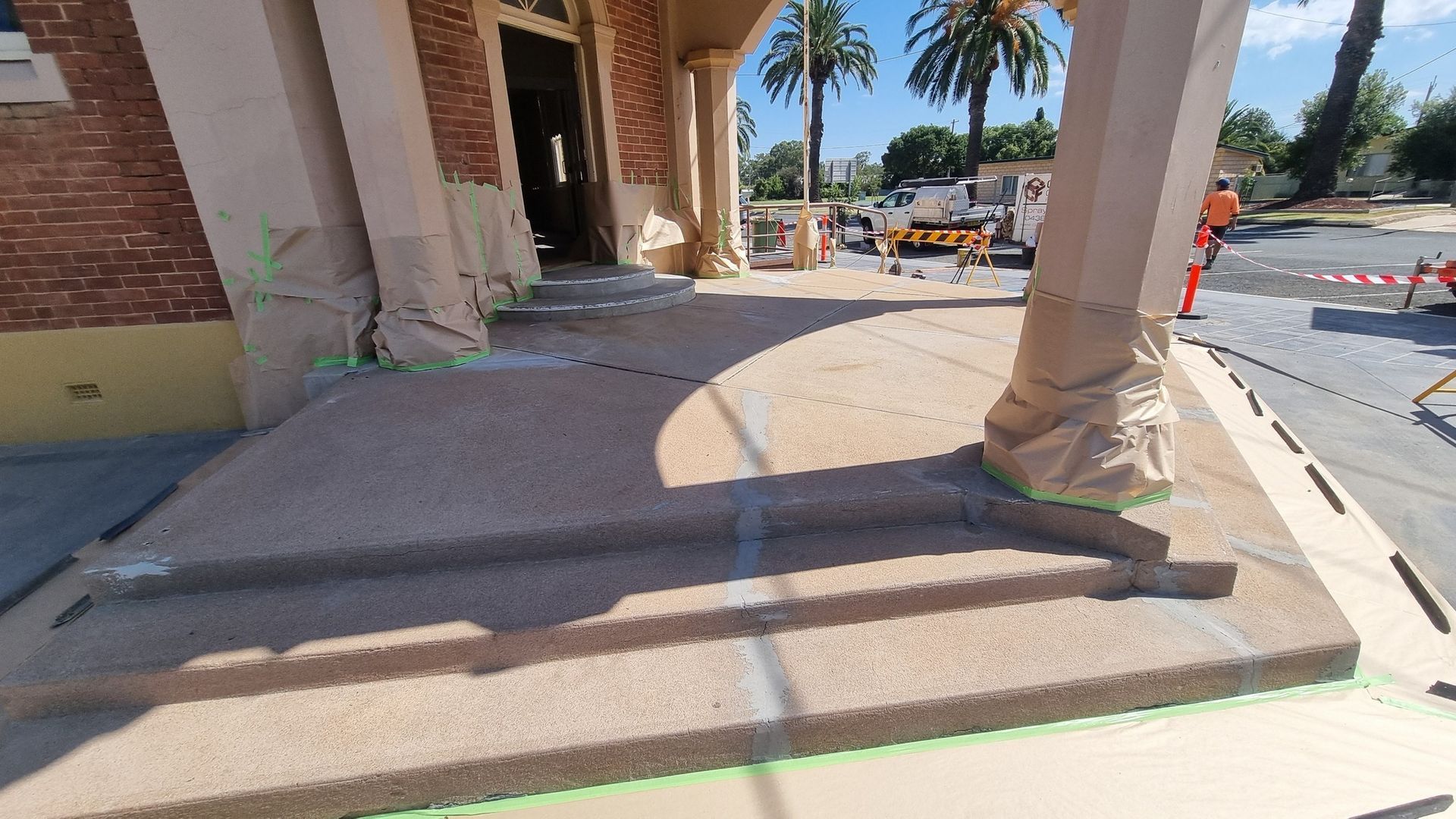 Cracked Concrete Steps and Ramp at Building Entrance