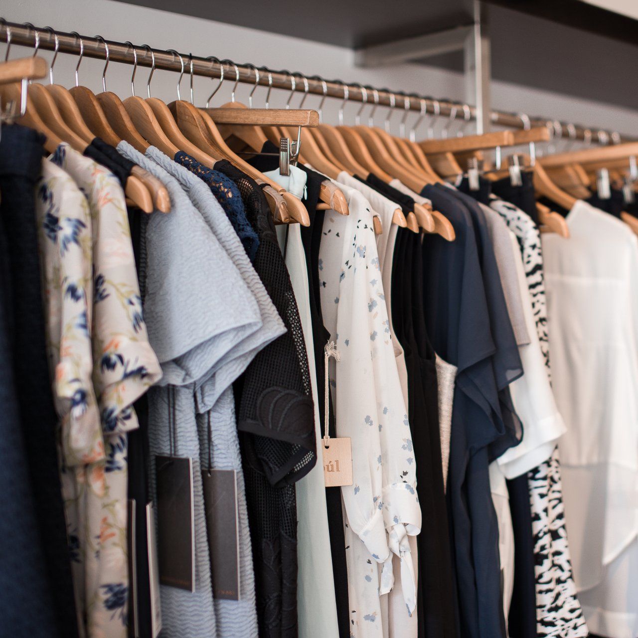Image of clothes hanging in a closet.