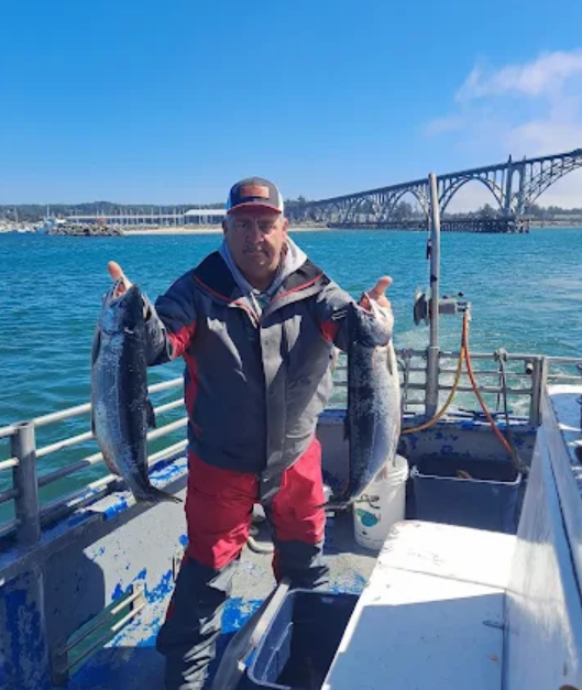 Two Men Caught a Salmon Fish