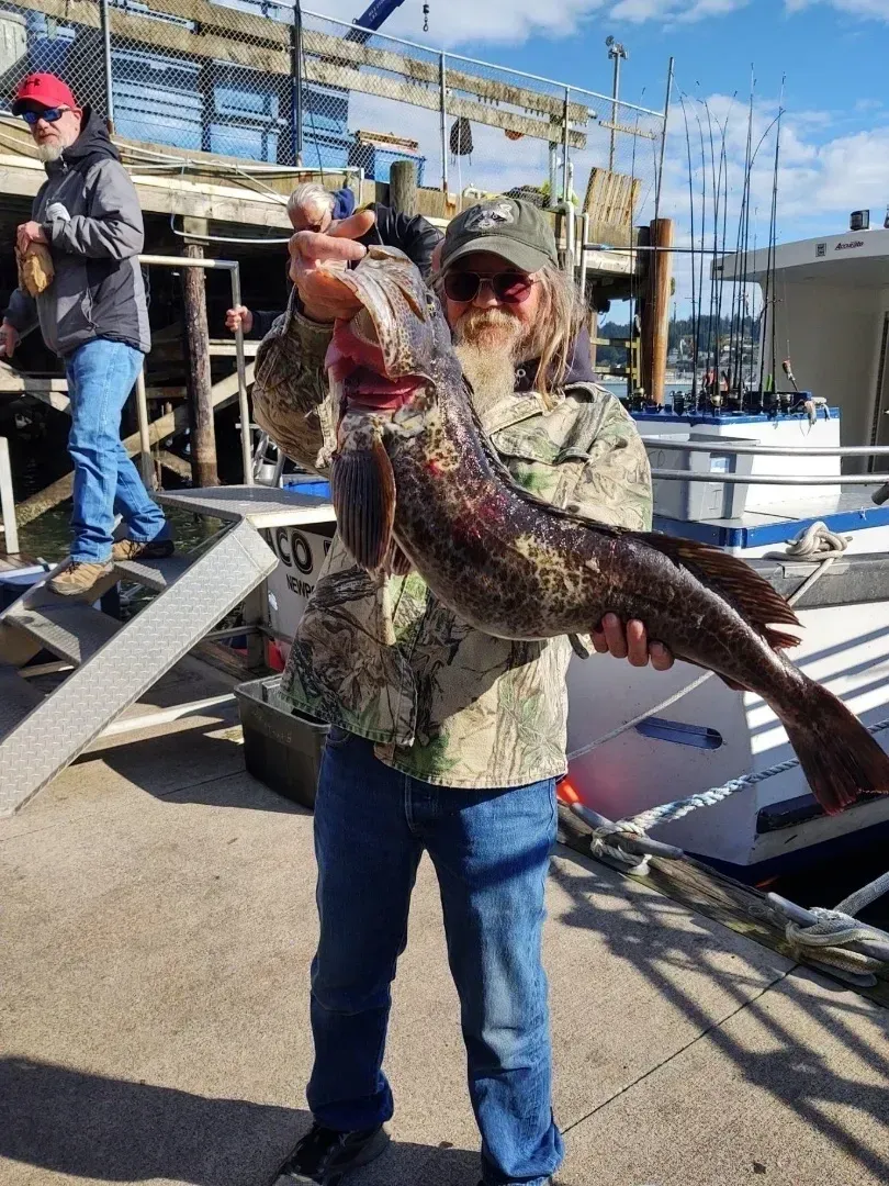 A Senior Man Holding a Large Fish