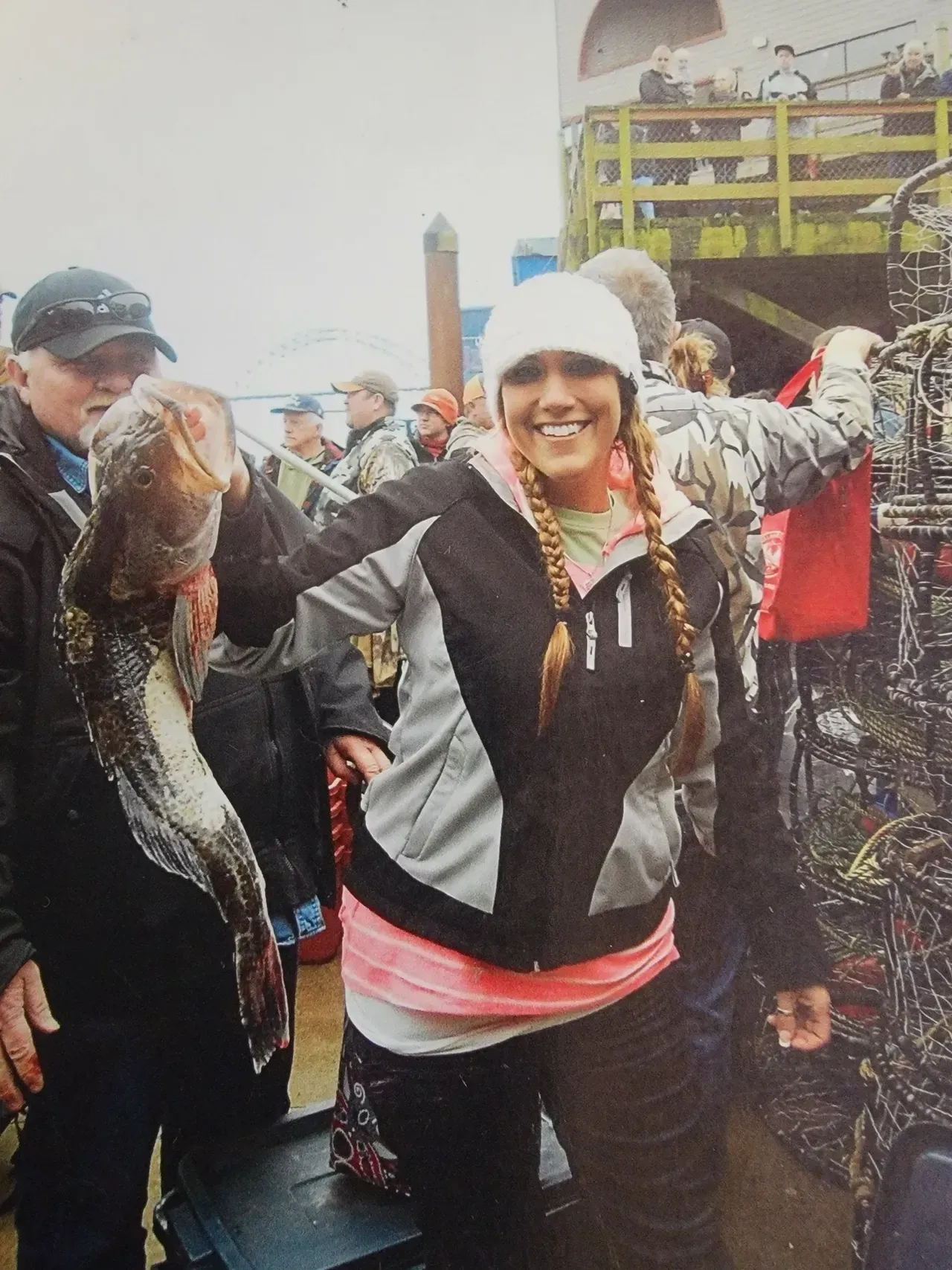 Woman Holding a Large Fish
