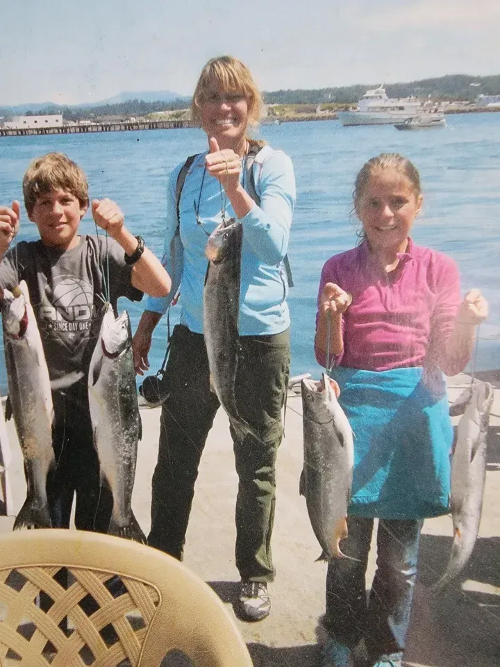 Mother and Children with their Caught Fish