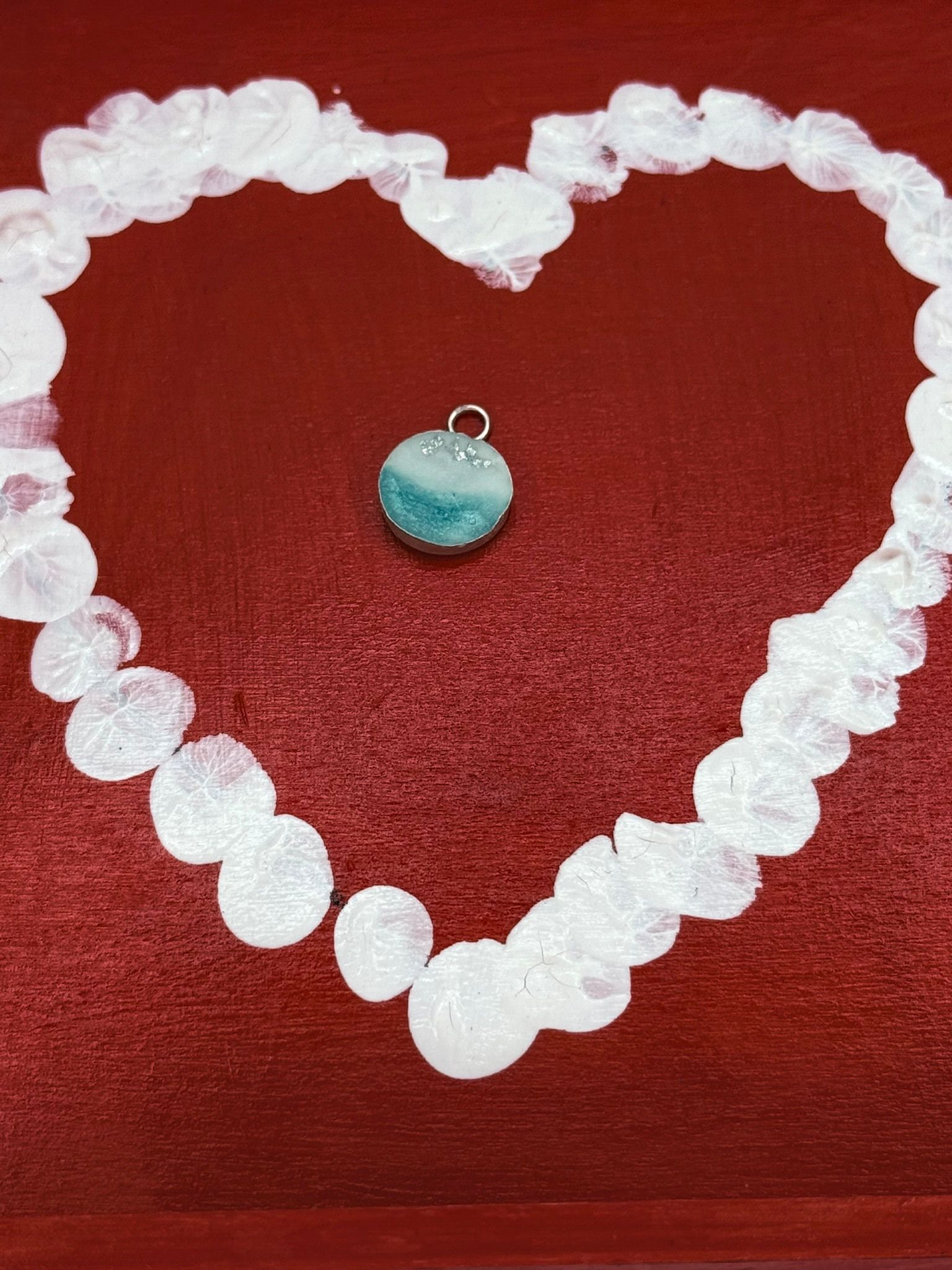 round pendant with details