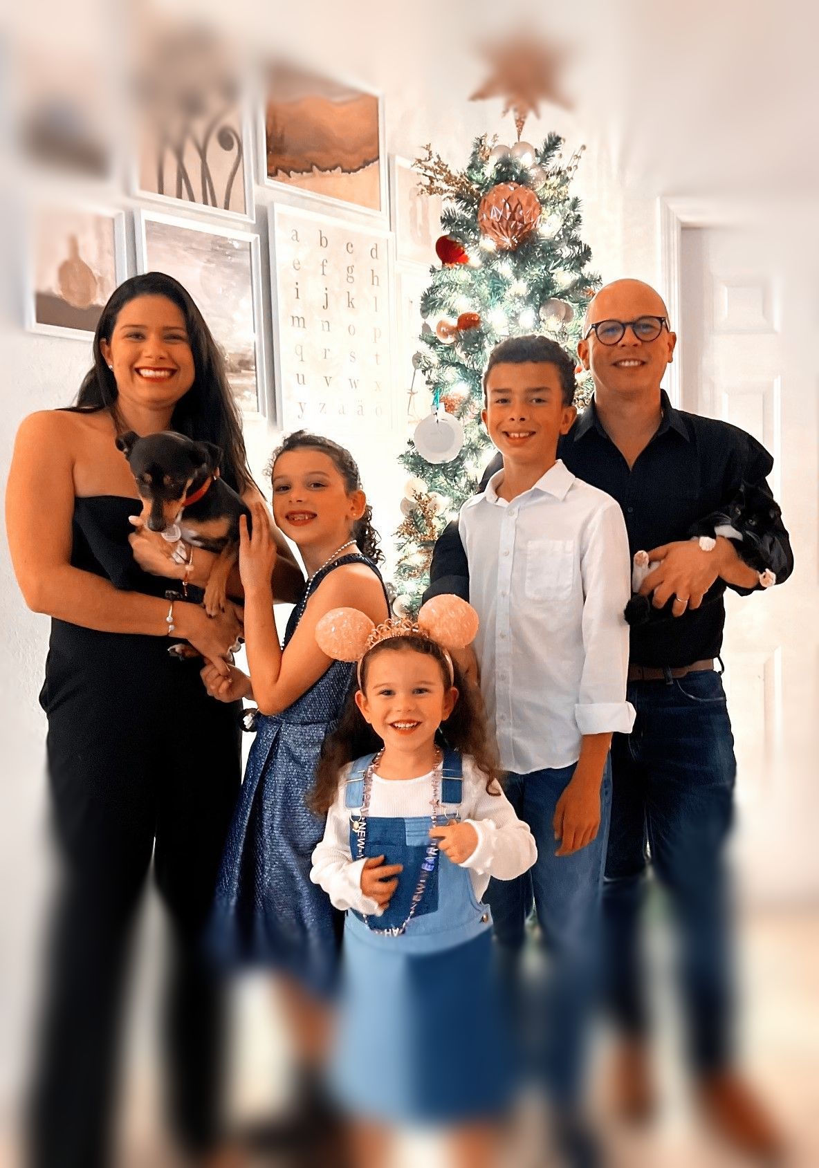 family picture by christmas tree 