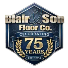 Gold and black 75th-anniversary logo for Blair & Son Floor Co., featuring crossed hammers and the years 1951-2026.