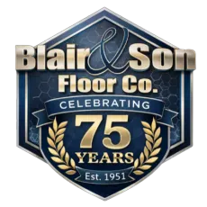 Gold and black 75th-anniversary logo for Blair & Son Floor Co., featuring crossed hammers and the years 1951-2026.