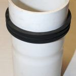 A White Plastic Pipe With A Black Rubber Ring Around It — Kirkland, WA — RJB Wholesale Inc.