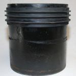 A Black Object With Cylinder Shape Sitting Is On A White Surface — Kirkland, WA — RJB Wholesale Inc.