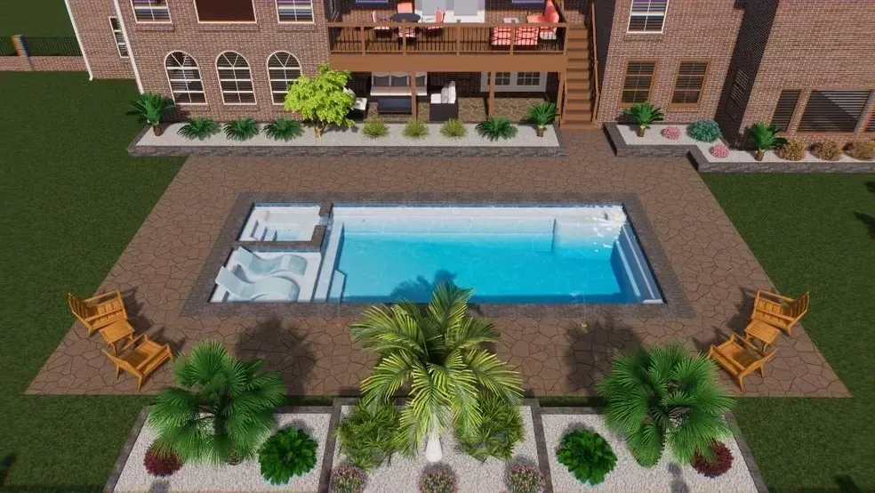 An aerial view of a large swimming pool in front of a brick house.