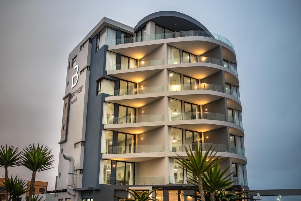 A large building with a lot of windows and balconies