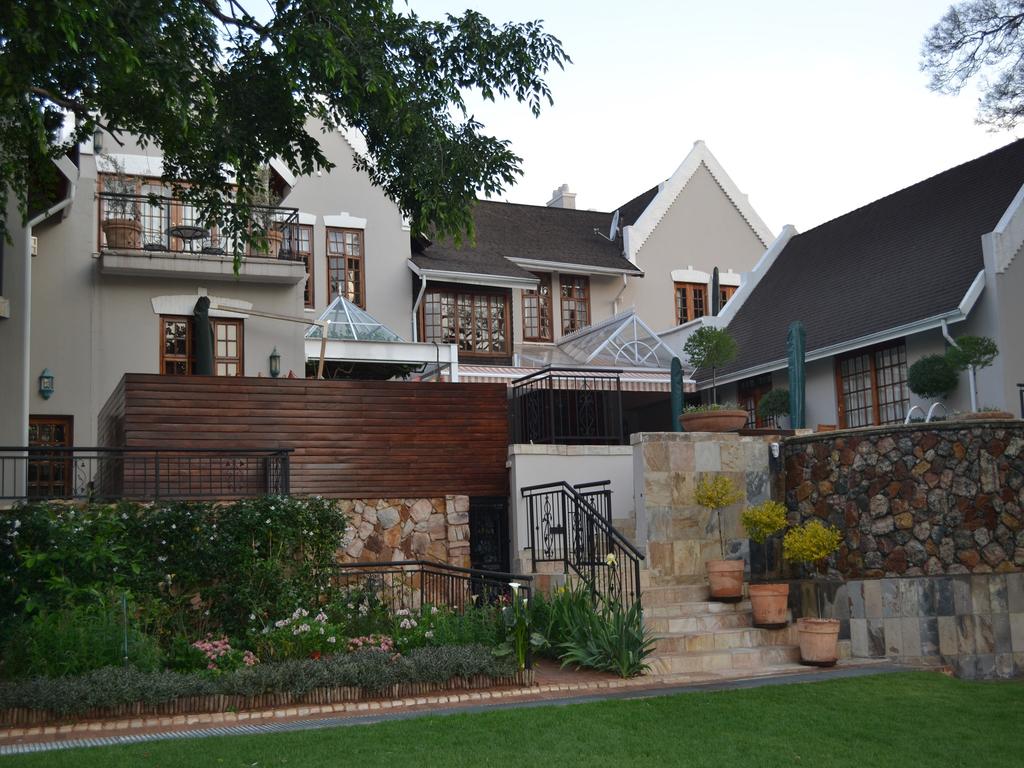 A large white house with a black roof