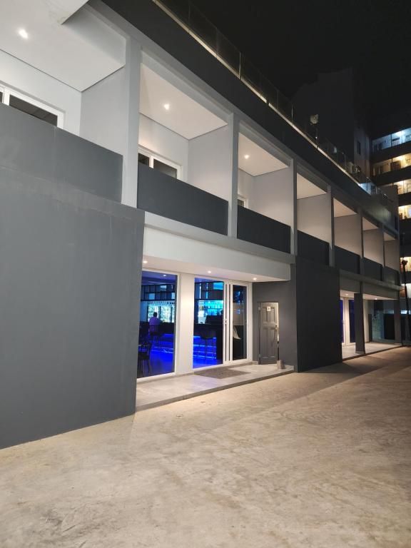 A building with a lot of windows and balconies at night