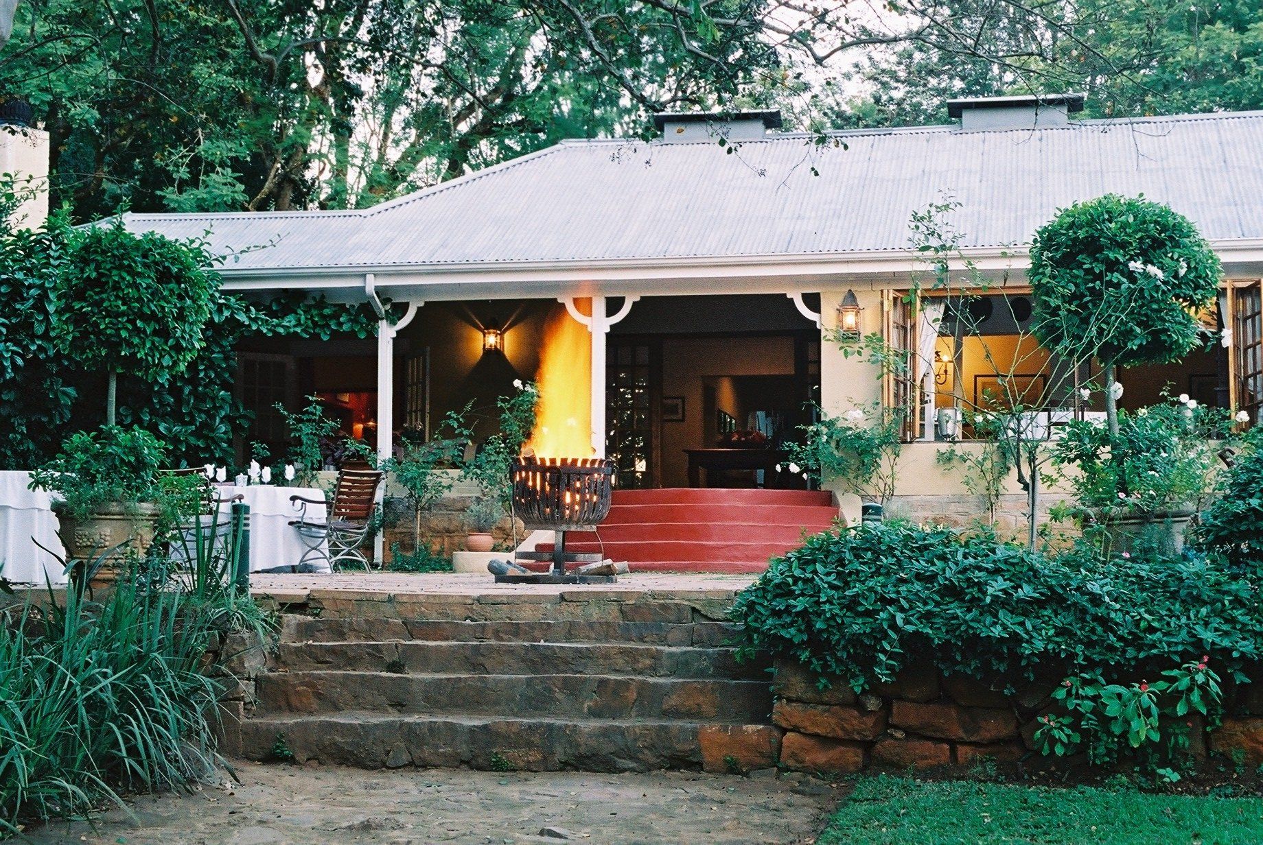 The front of a house with a porch and stairs
