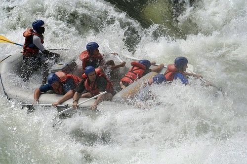 A group of people are rafting down a river.