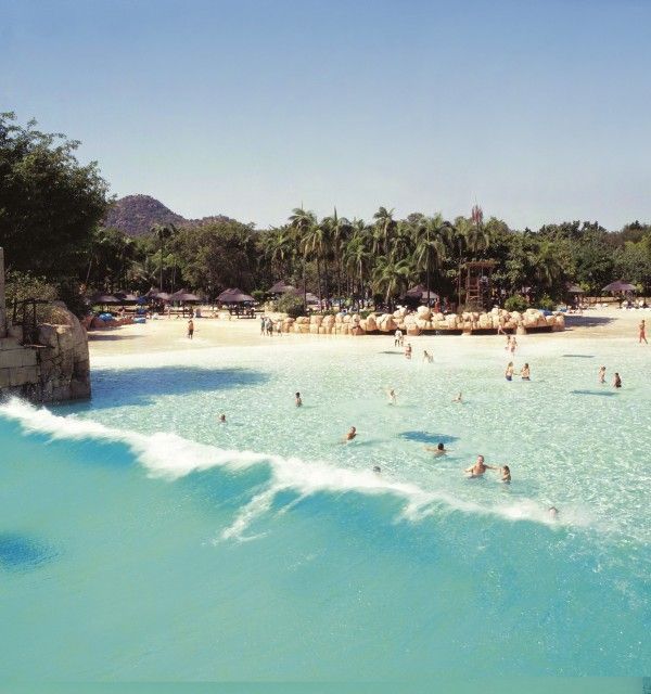 A group of people are swimming in a large body of water