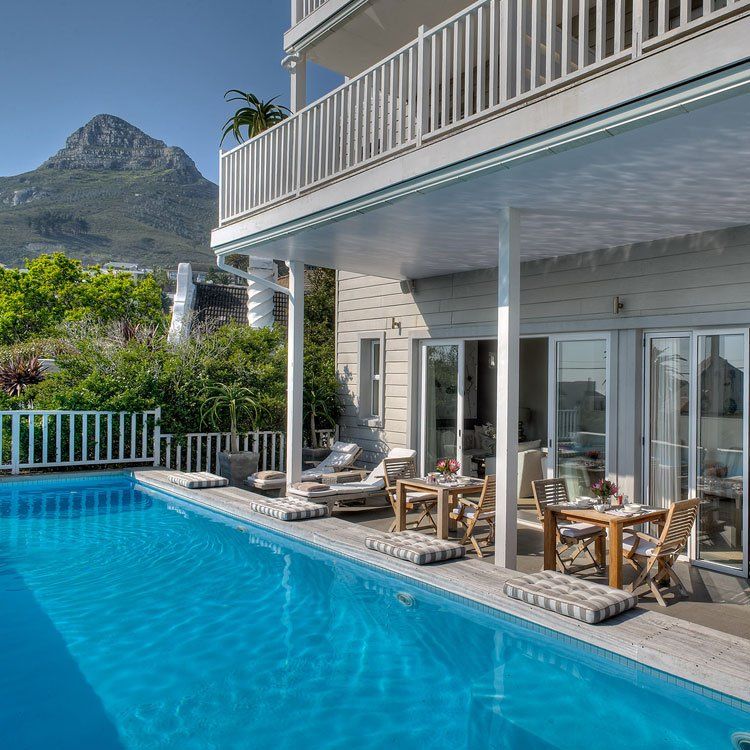 A large swimming pool with a mountain in the background
