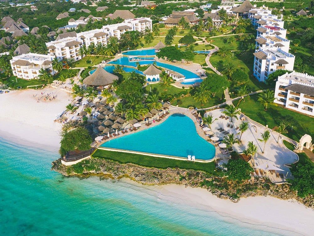 An aerial view of a resort with a heart shaped pool