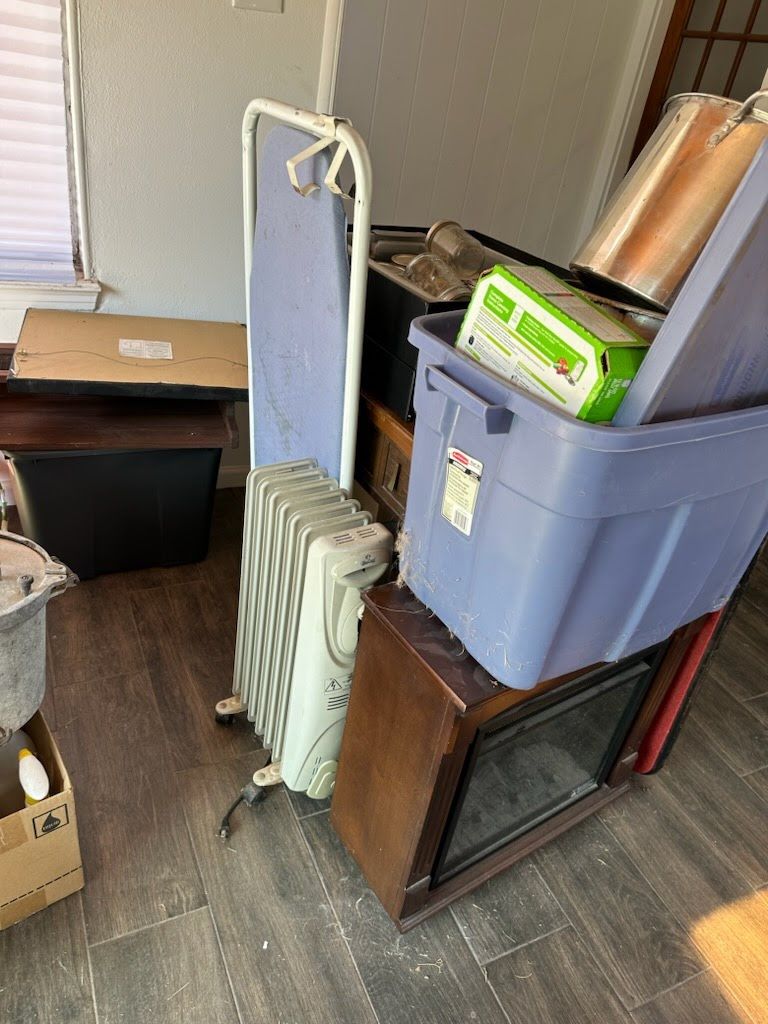 A room filled with lots of boxes and appliances.