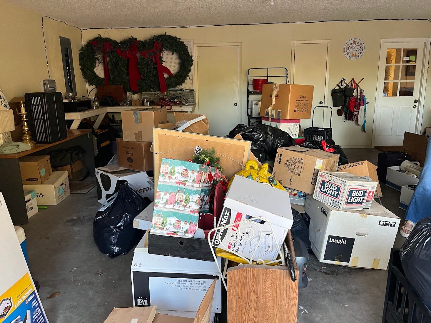 A garage filled with lots of boxes and bags.