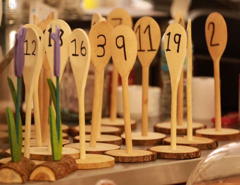 A bunch of wooden spoons with numbers on them
