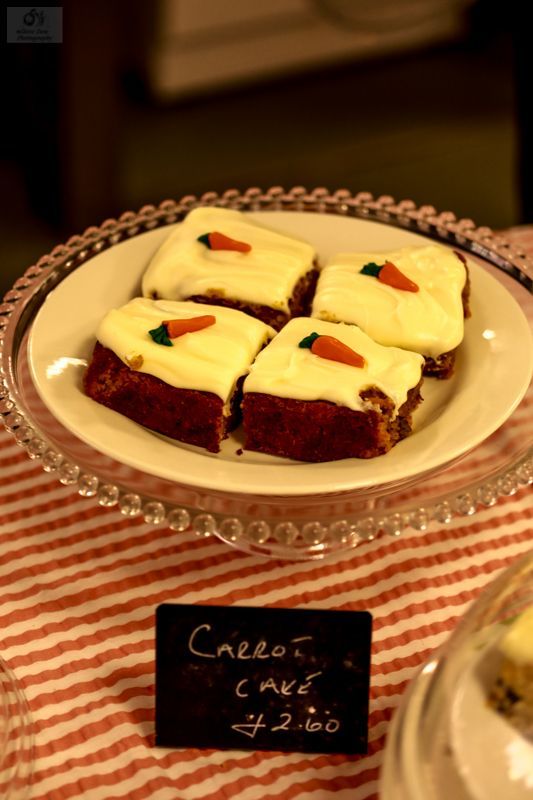 A table with a variety of cakes and pastries on it.