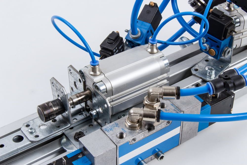 A Machine With Blue Hose Attached To It — Hitemp Compressed Air Services in Campbelltown, NSW