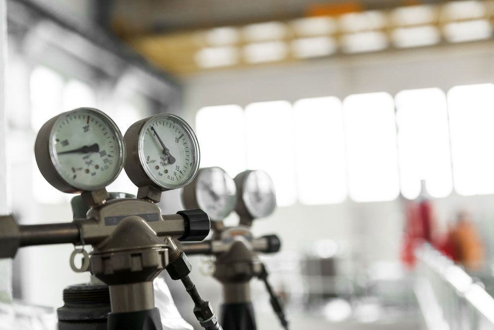 Row Of Pressure Gauges In A Factory — Hitemp Compressed Air Services in Campbelltown, NSW