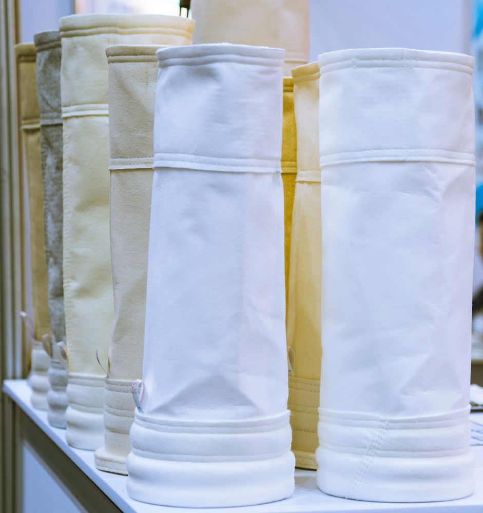 Row Of Dust Filter On Top Of A White Table — Hitemp Compressed Air Services in Fairy Meadow, NSW