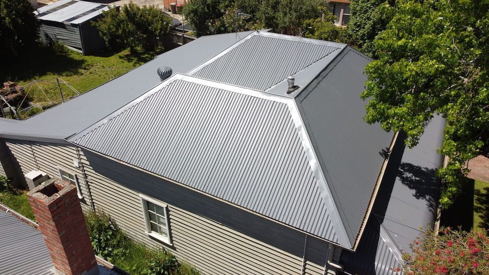 An Aerial View of a House With a Metal Roof — iFix Roofing Bendigo in White Hills, VIC