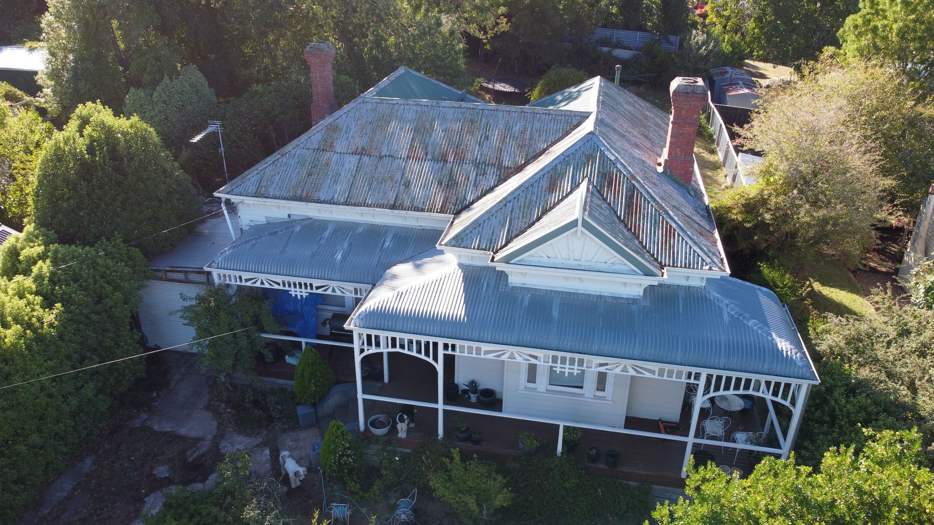 An Aerial View of a Brick House With a Metal Roof — iFix Roofing Bendigo in Bendigo, VIC
